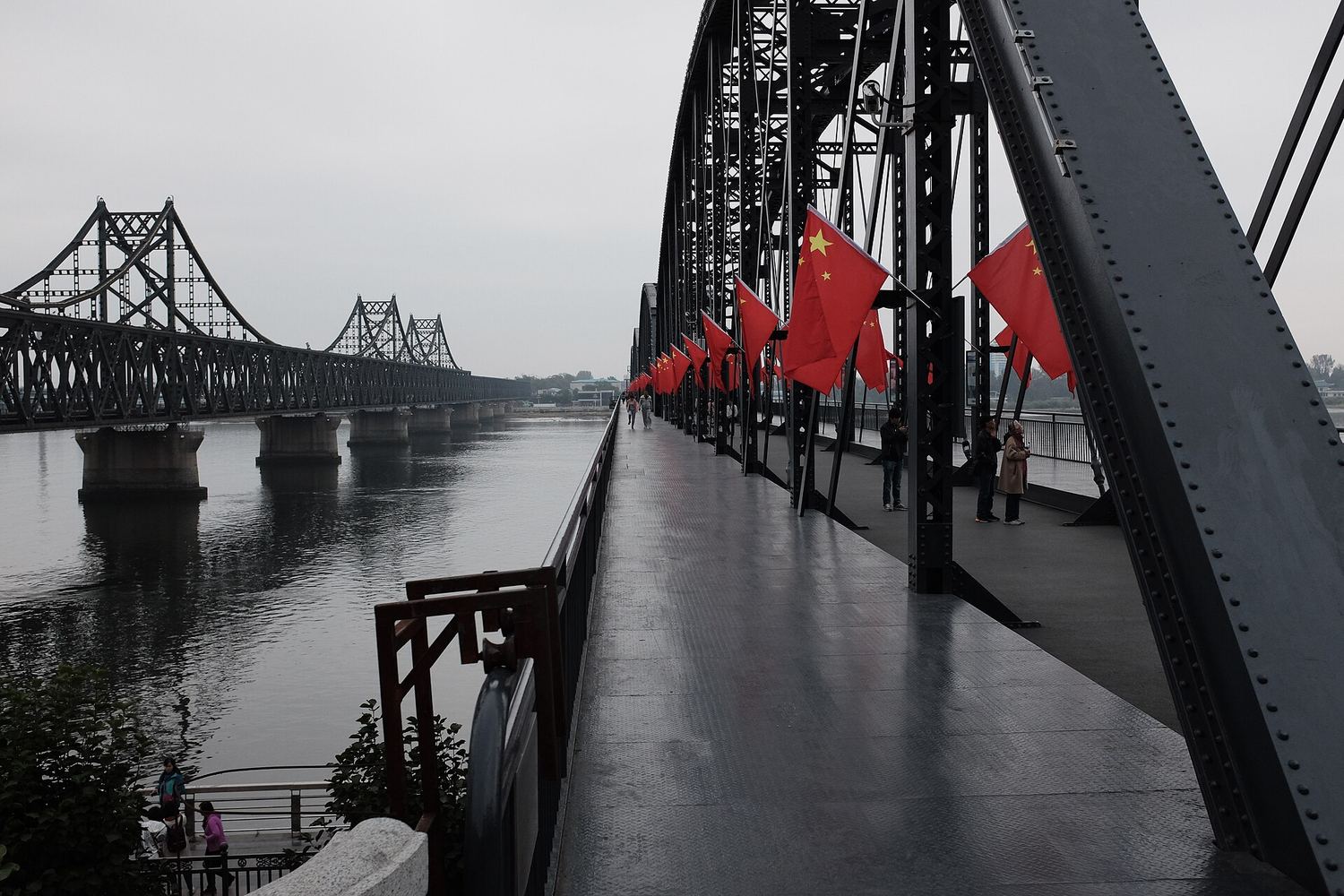 The Sino-Korean Friendship Bridge over the Yalu River, seen from the Broken Bridge in Dandong
